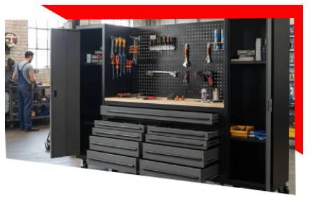 Modern black tool workbench with pegboard, drawers, and organized tool storage in a workshop