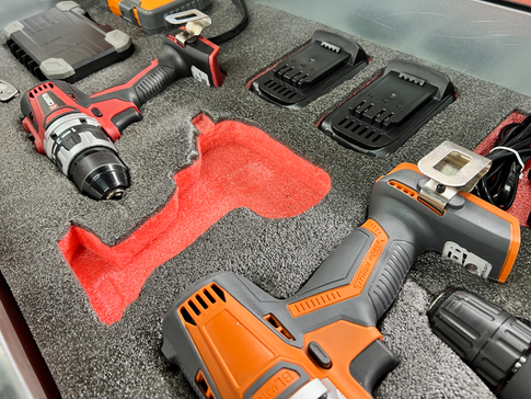 Foam tool organizer tray with cordless drills, battery chargers, and power tool storage slots