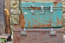 two rectangular blue and red metal containers