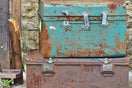 two rectangular blue and red metal containers