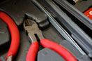 red and black handle stainless steel tool