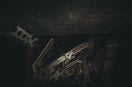 stainless steel hand tool on black wooden table