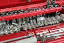 a red toolbox filled with lots of tools