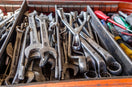 a box filled with lots of wrenches and other tools