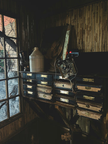 a motorcycle parked on top of a wooden table