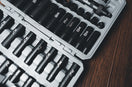 a case filled with lots of black and white tools