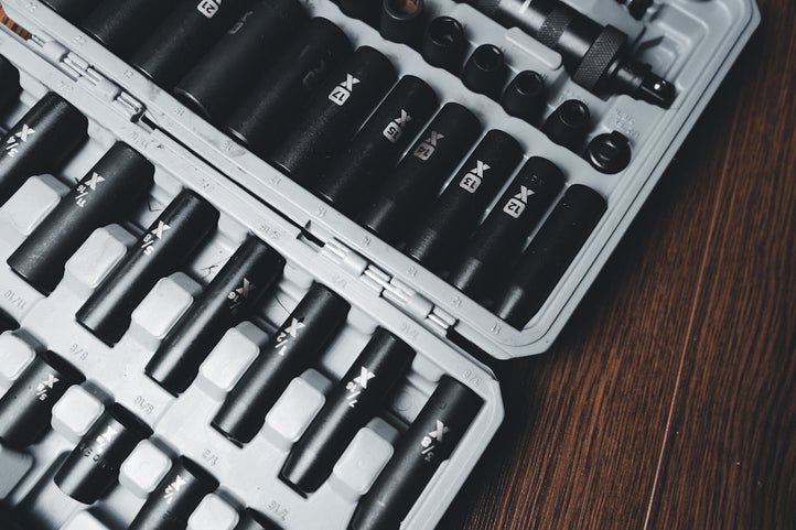 a case filled with lots of black and white tools