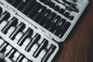 a case filled with lots of black and white tools