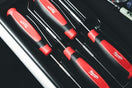 a set of red and black kitchen knives in a case