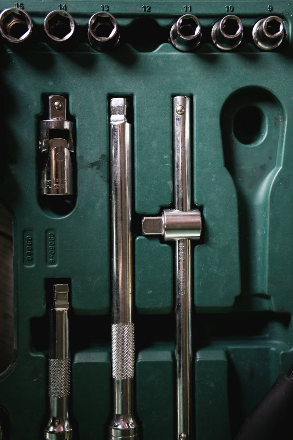 a green box with a bunch of tools inside of it