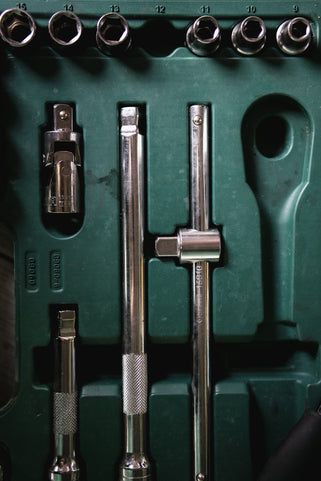 a green box with a bunch of tools inside of it