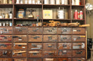 A shelving unit filled with tools and supplies.