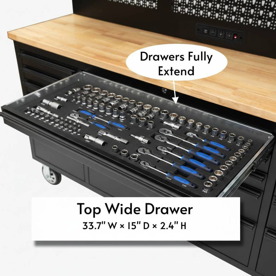 Workbench with fully extended top wide drawer organized with sockets, ratchets and hand tools